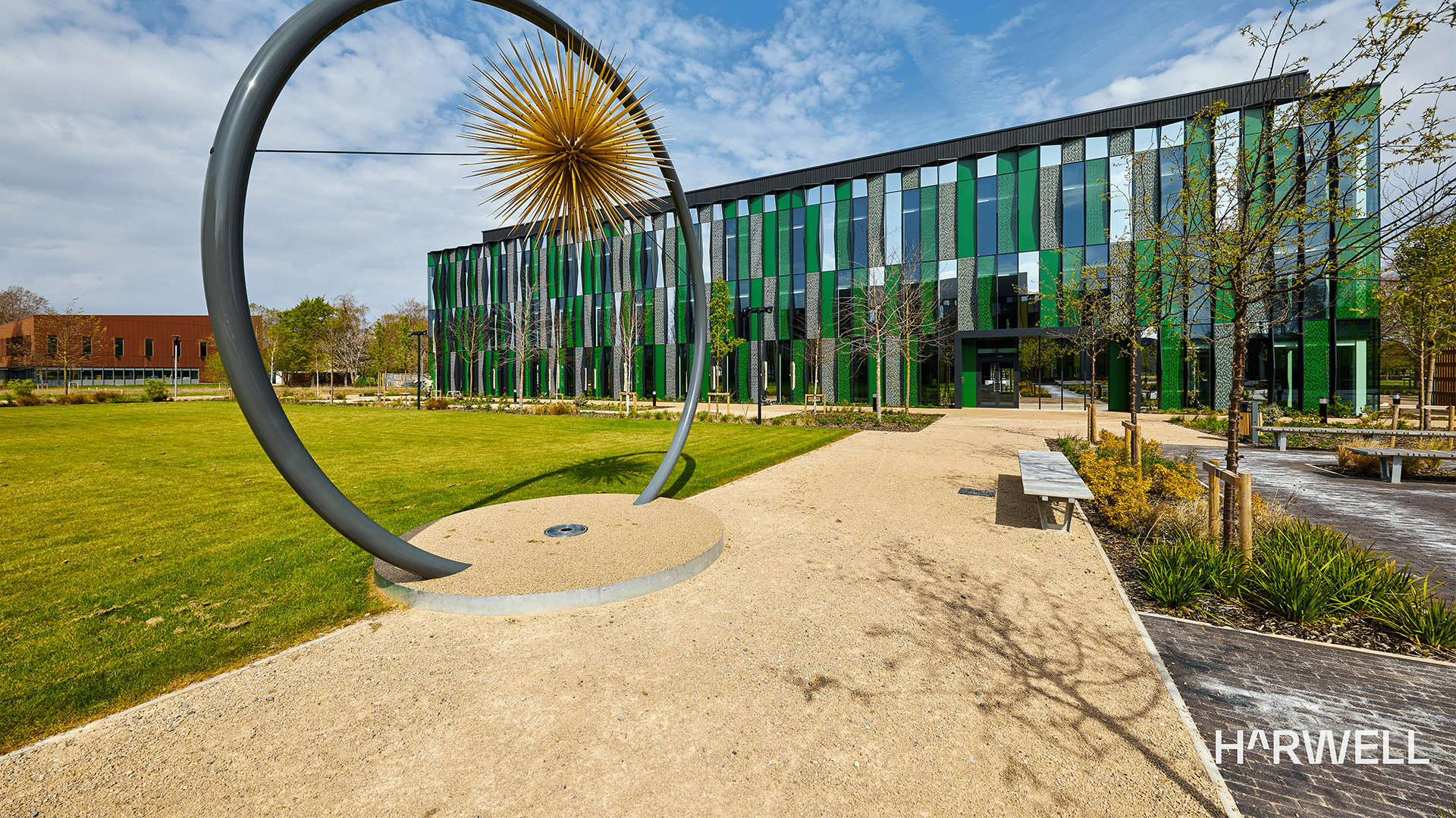 Harwell Campus with a modern installation outside on a sunny day